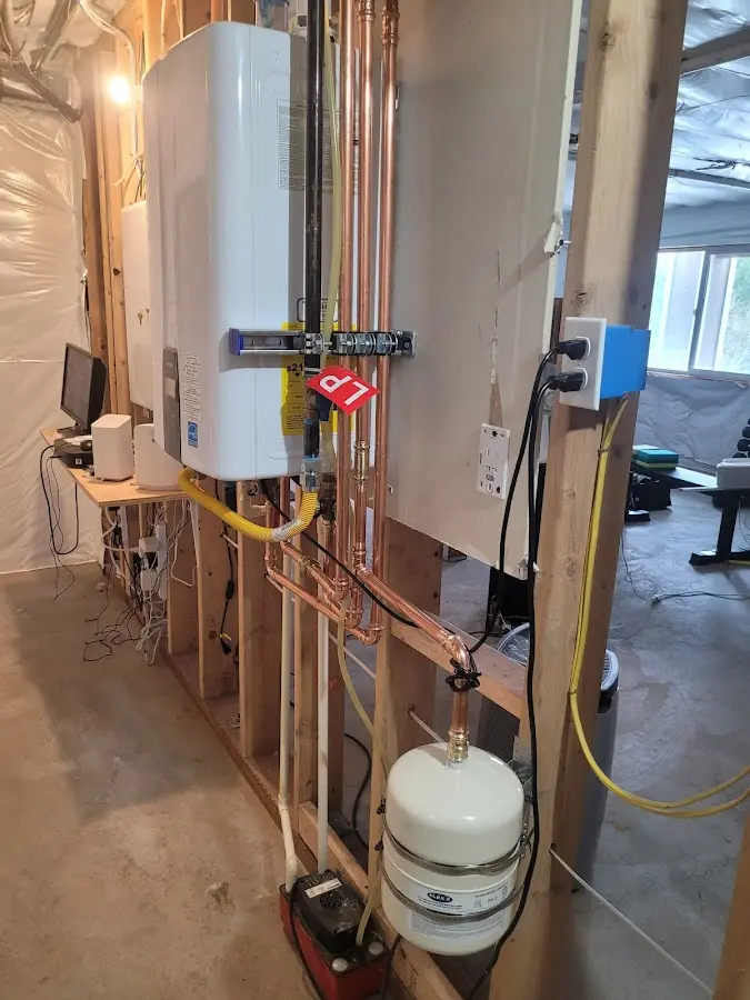Licensed plumber repairing a kitchen sink in Rockford